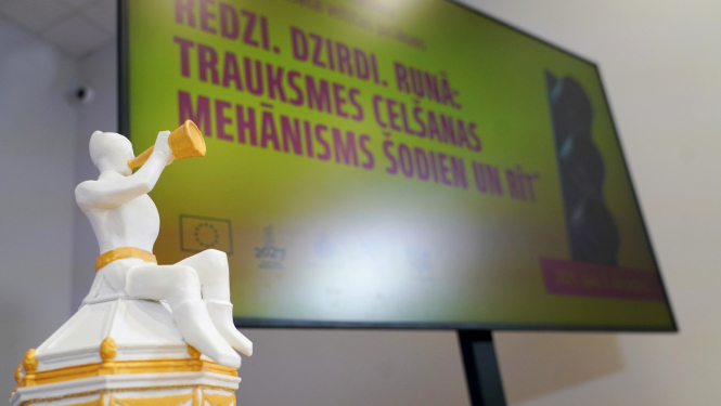 Taurētāja figūriņa, kas simbolizē trauksmes cēlēju