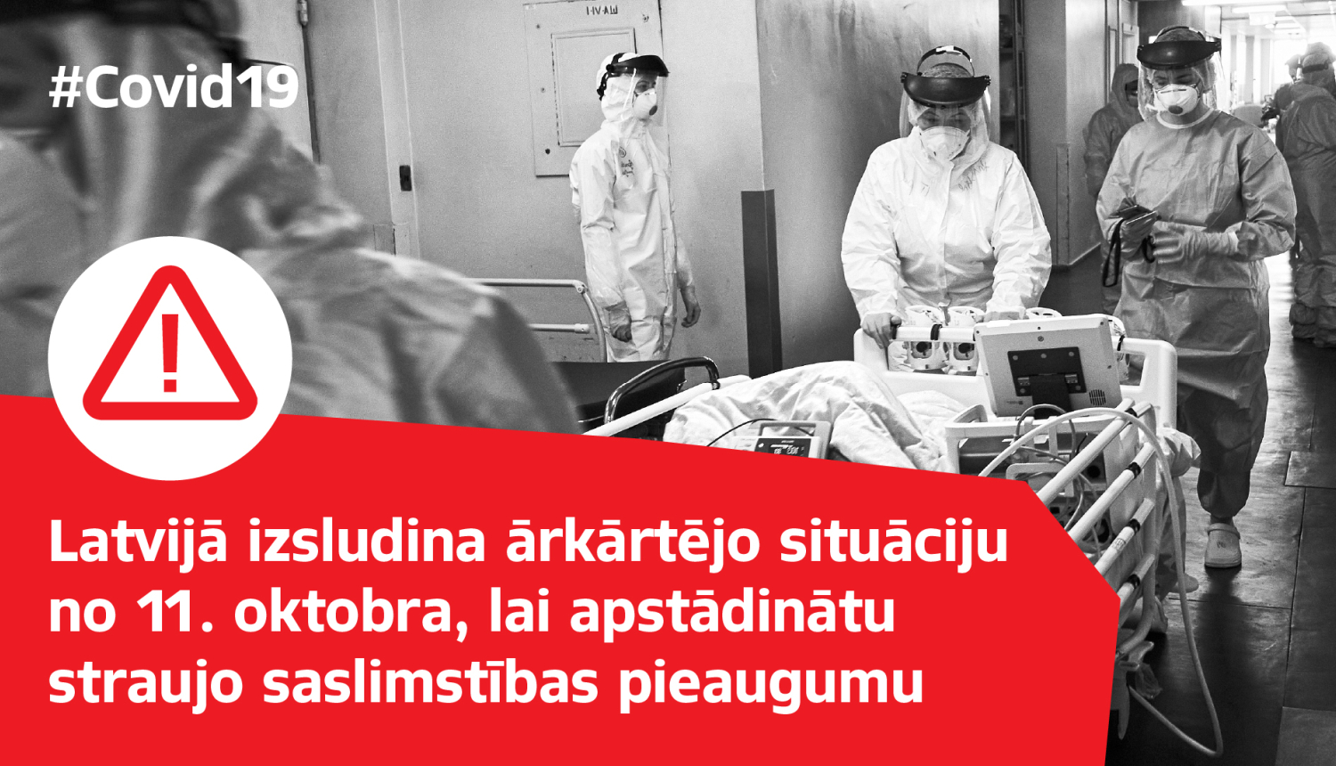 Melnbalts attēls ar mediķiem,kas ved Covid-19 pacientu, uzraksts "Latvijā izsludina ārkārtējo situāciju no 11.oktobra, lai apstādinātu straujo saslimstības pieaugumu"