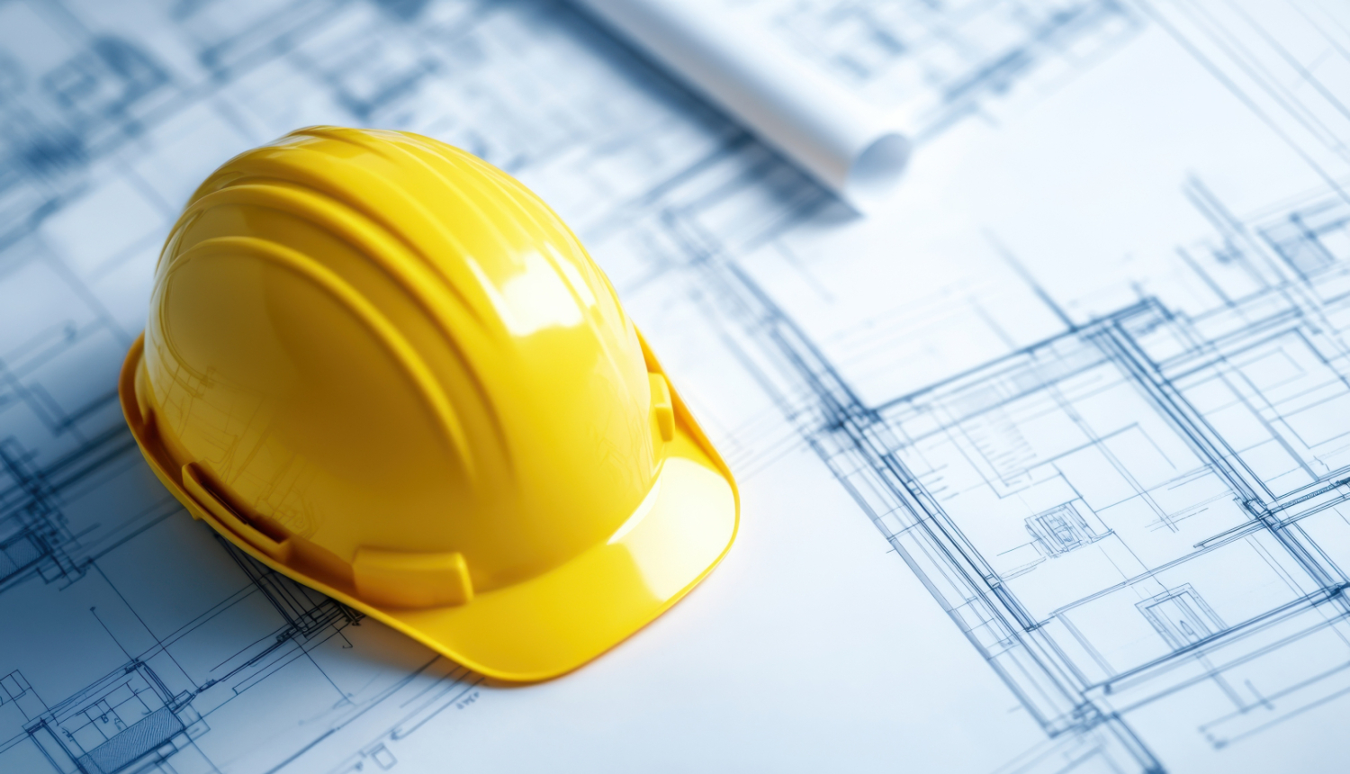 Plāni un rasējumi, uz kuriem novietota dzeltena ķivere